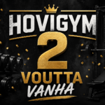 HoviGym 2 vuotta – tumma ja blurattu kuntosali tausta sekä kynttilällä varustettu kakkonen cupcake päällä